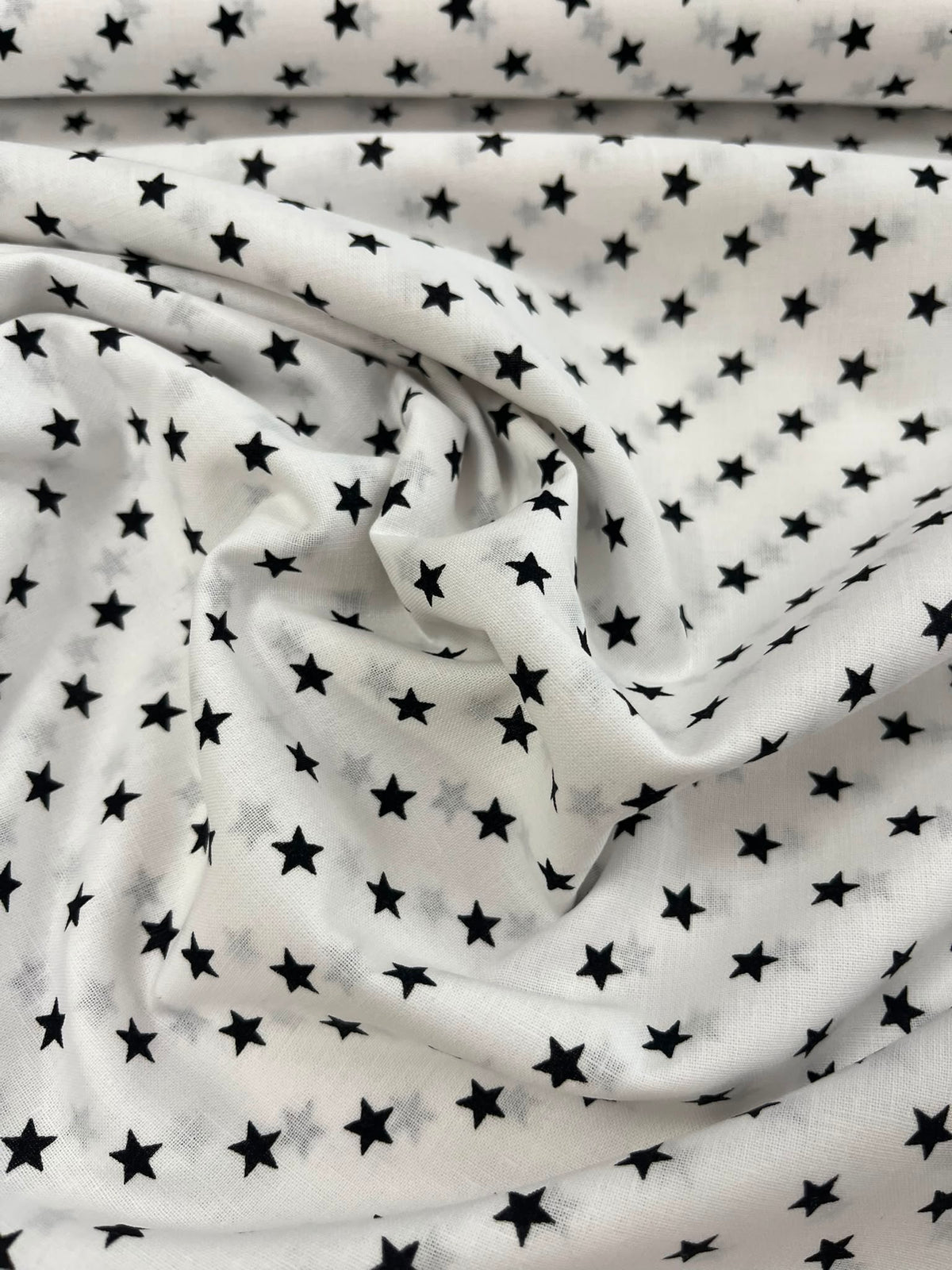 Algodón estrellas negras - detalle caída