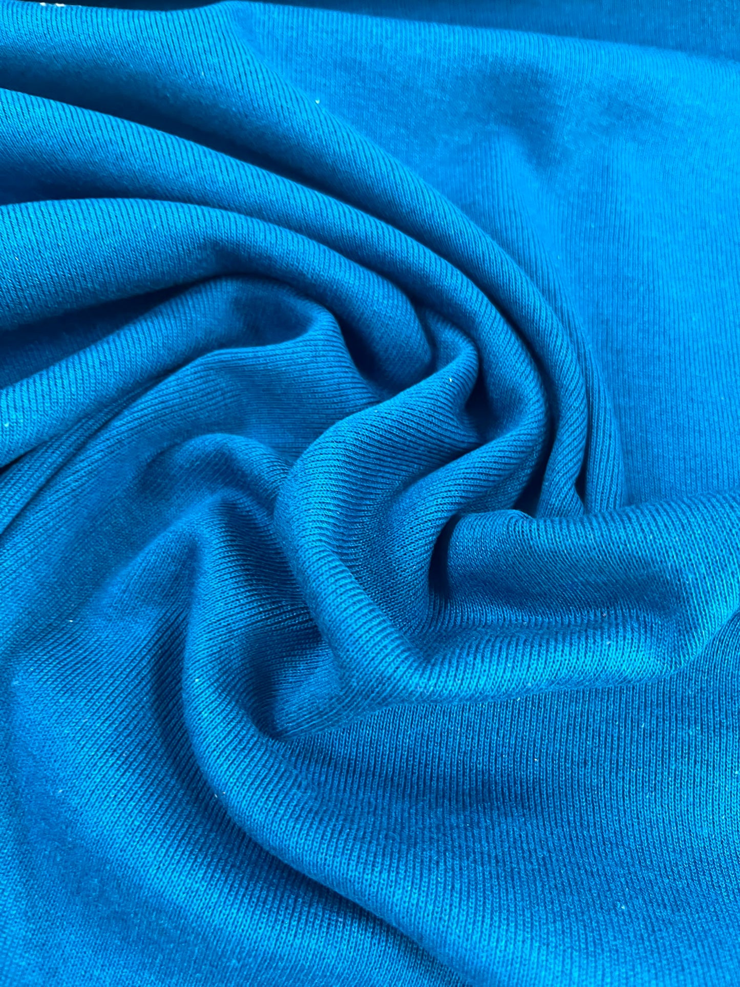 Punto tubular azul turquesa - detalle caída y textura canalé