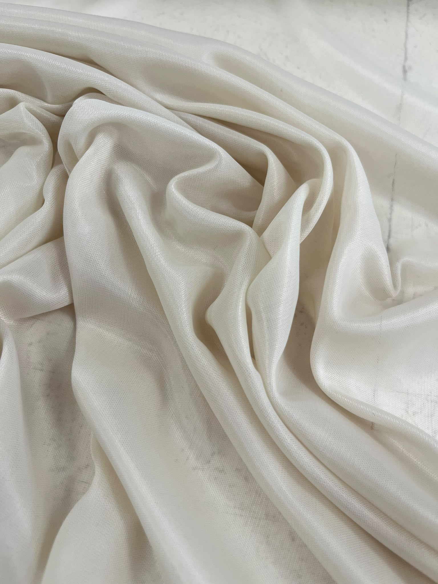Forro elástico combinación beige - detalle caída sedosa