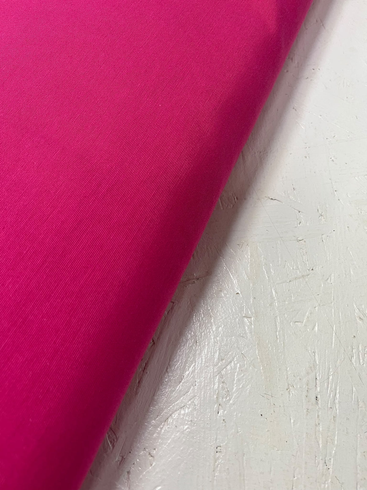 Tela de loneta fucsia lisa con detalle de la trama