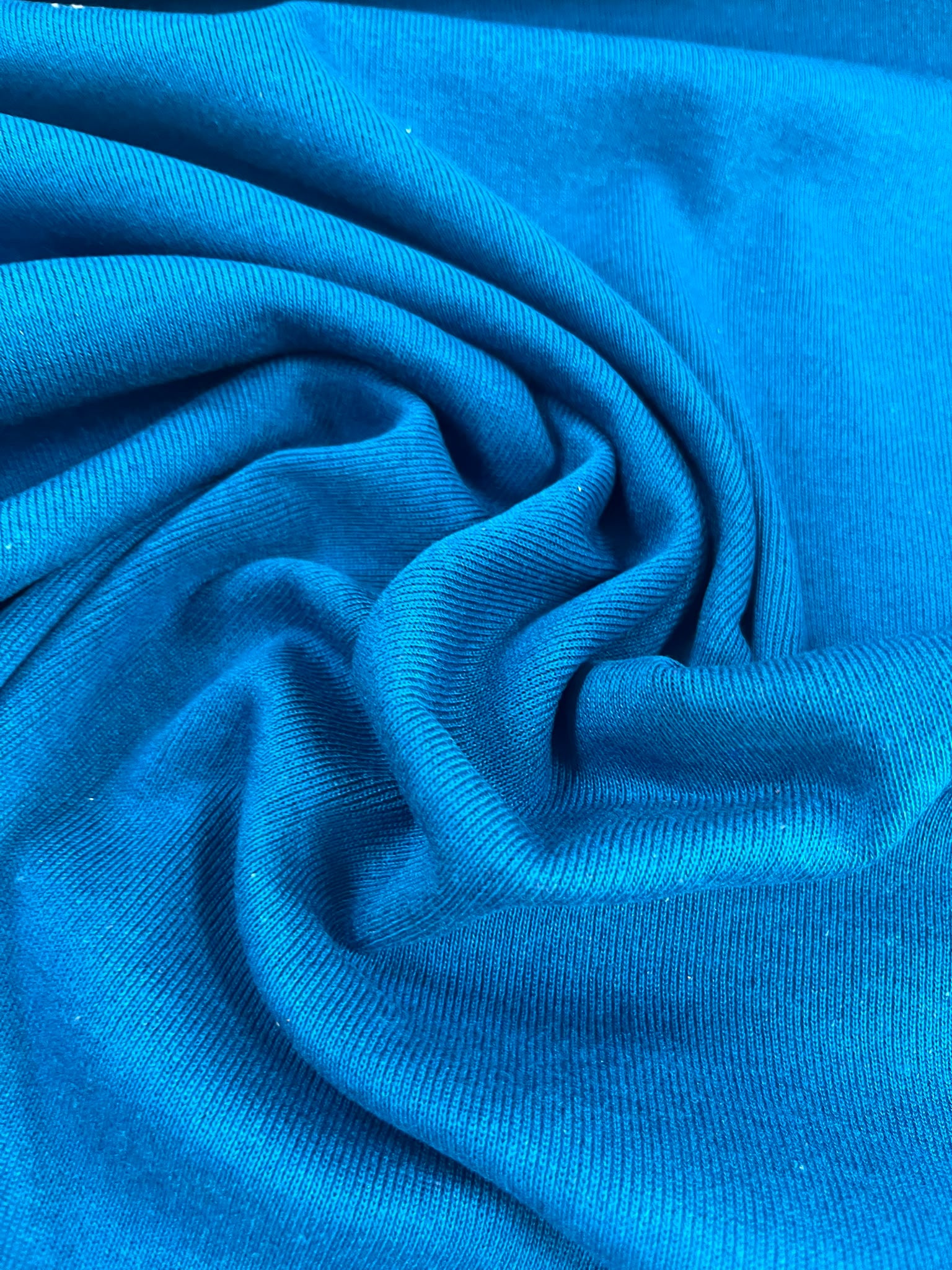Punto tubular azul turquesa - detalle caída y textura canalé