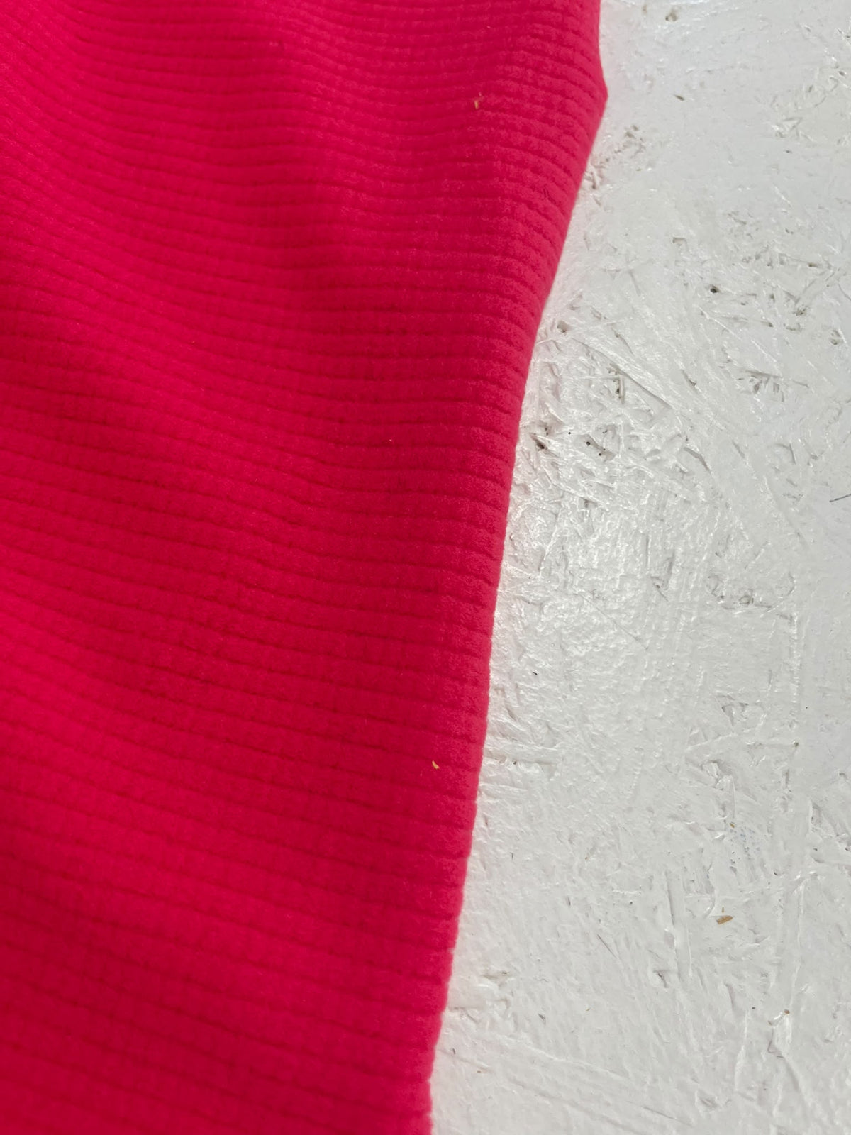 Forro Polar Fucsia - detalle textura acanalada cara exterior
