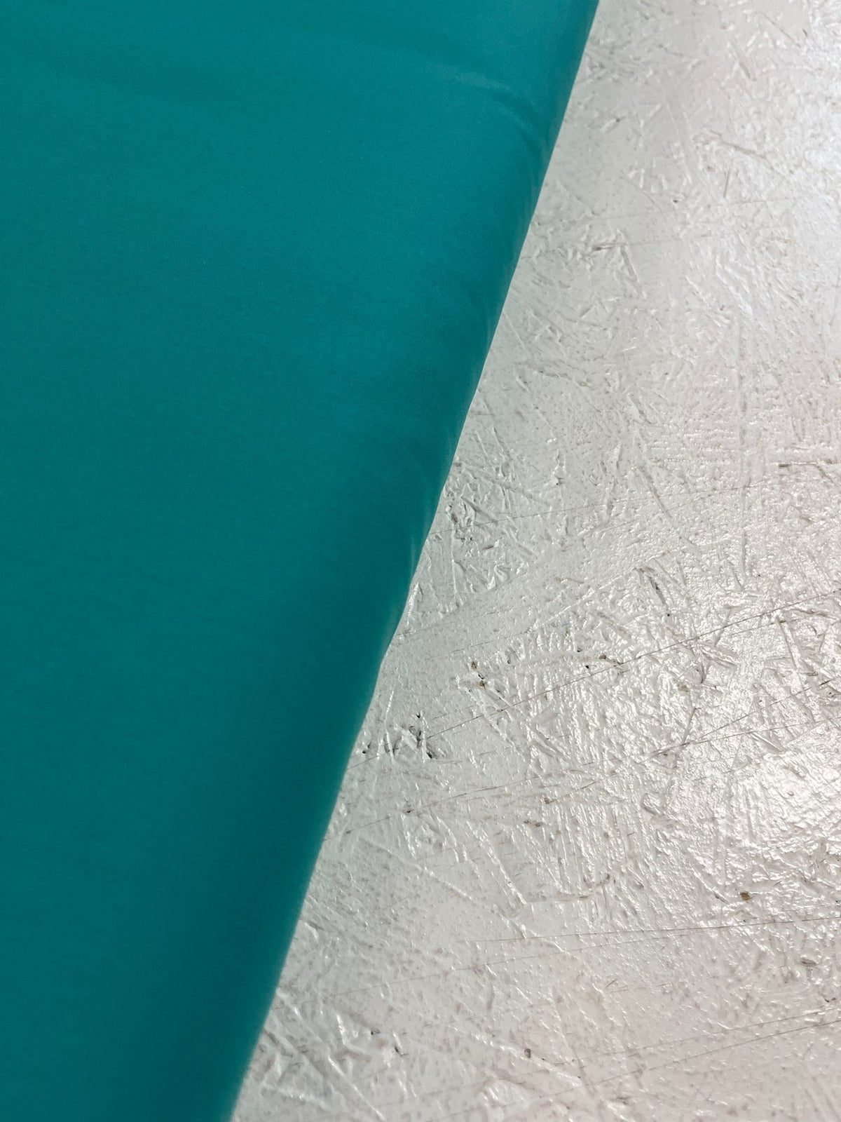 Popelín verde azulado - detalle orillo
